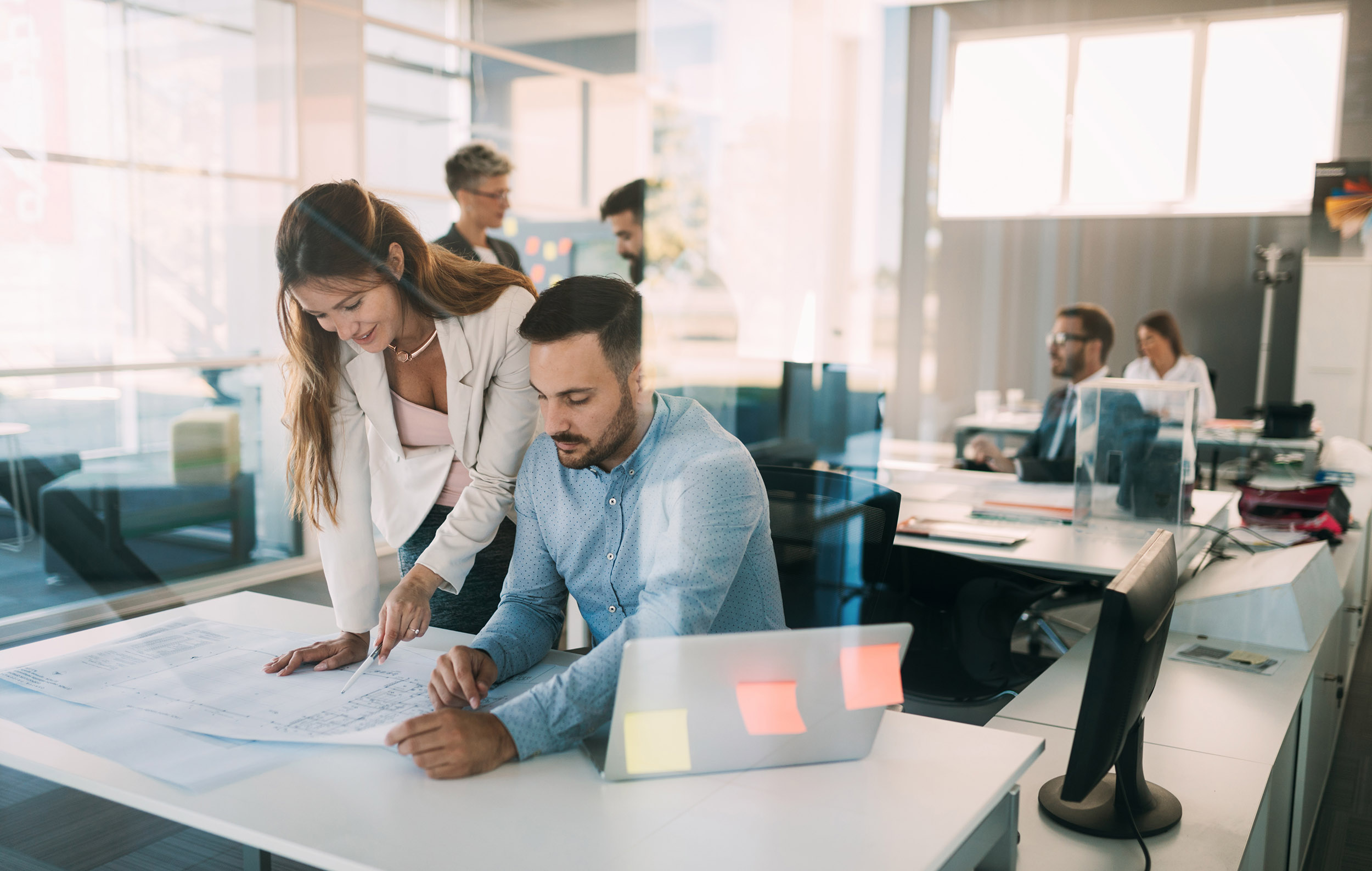 Group of coworkers working together on business project in office